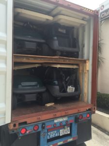 golf carts in container